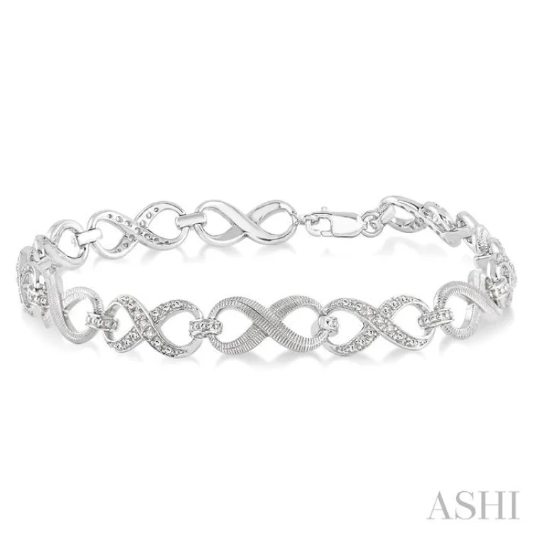 Ladies bracelets floral accents-1/10 Ctw Round Cut Diamond Swirl bracelet in Sterling Silver