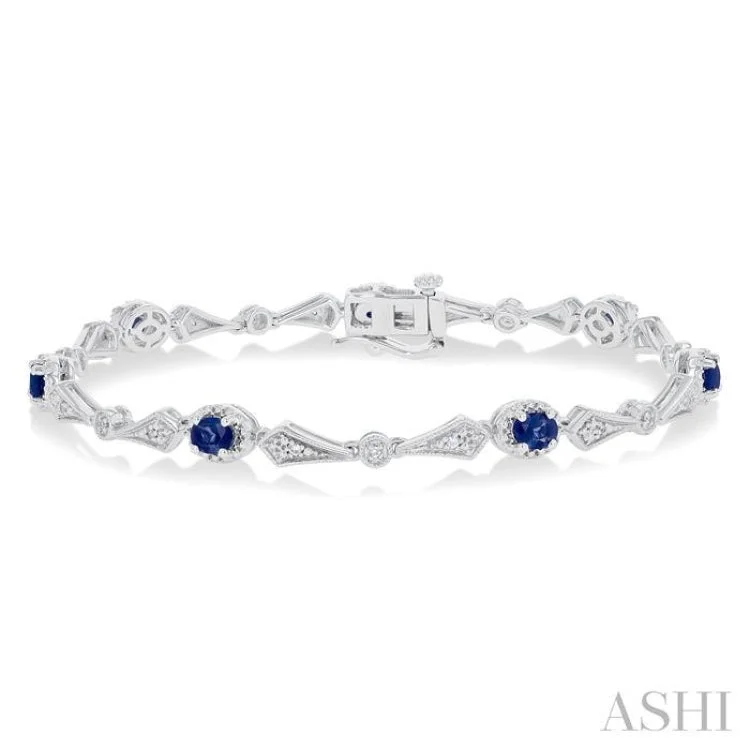 Ladies bracelets work wear-1/10 ctw Oval Cut 4X3MM Sapphire and Round Cut Diamond Precious Bracelet in 10K White Gold