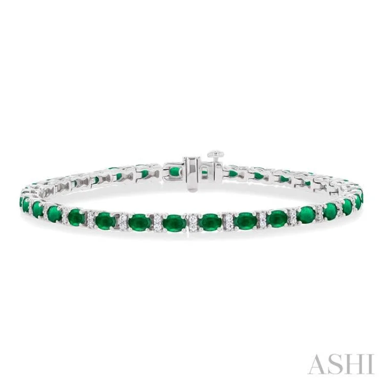 Ladies bracelets clean lines-1/3 ctw Oval Cut 4X3MM Emerald and Round Cut Diamond Precious Bracelet in 14K White Gold