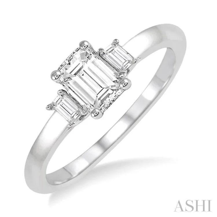 Ladies engagement rings pave designs-5/8 Ctw Emerald and Baguette Diamond Engagement Ring with 1/2 Ct Emerald cut Center Stone in 14K White Gold