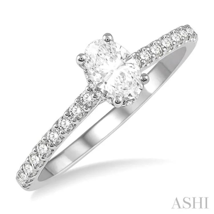 Ladies engagement rings minimalist looks-1/2 Ctw Round Cut Diamond Engagement Ring With 1/4 ct Oval Cut Center Stone in 14K White Gold