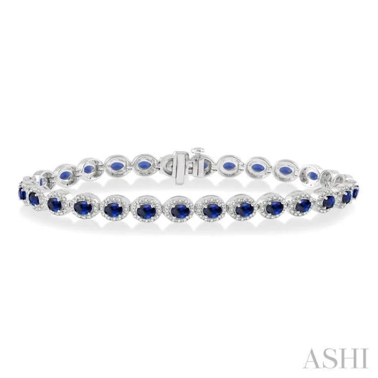 Ladies bracelets jade accents-1 Ctw Round Cut Diamond & 4x3MM Oval Cut Sapphire Precious Bracelet in 14K White Gold