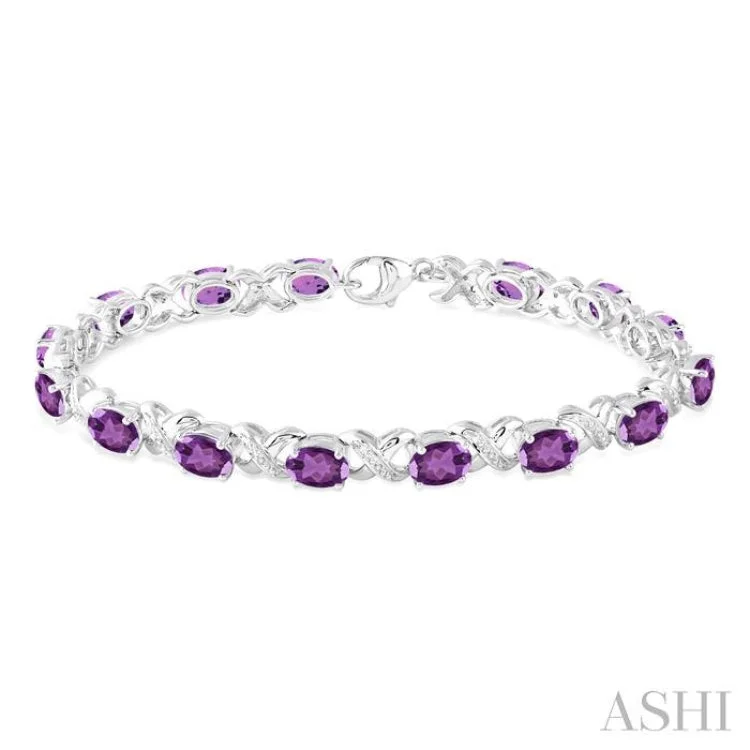 Ladies bracelets bridal must-haves-7x5 mm Oval Cut Amethyst and 1/20 Ctw Round Cut Diamond Fashion Bracelet in Sterling Silver