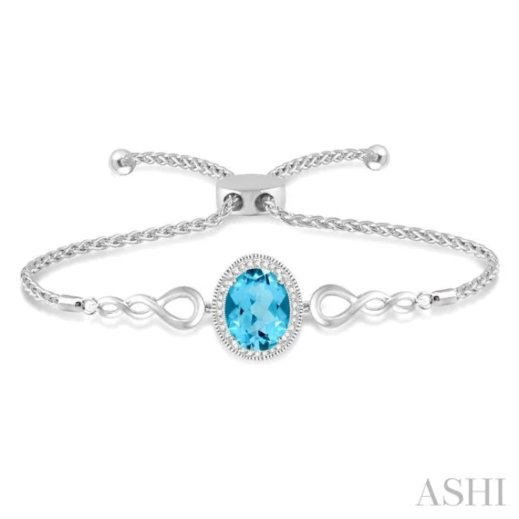 Ladies bracelets budget picks-1/20 Ctw Oval 10x8mm Blue Topaz Round Diamond Sterling Silver Lariat Bracelet