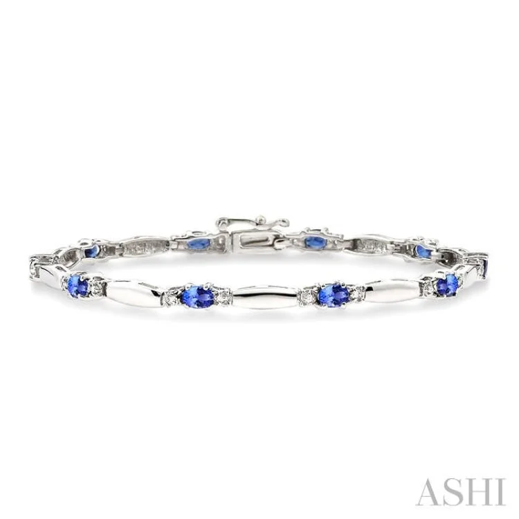 Ladies bracelets price options-1/10 Ctw Bar and Oval Mount Round Cut Diamond & 5x3MM Oval Cut Tanzanite Precious Bracelet in 10K White Gold