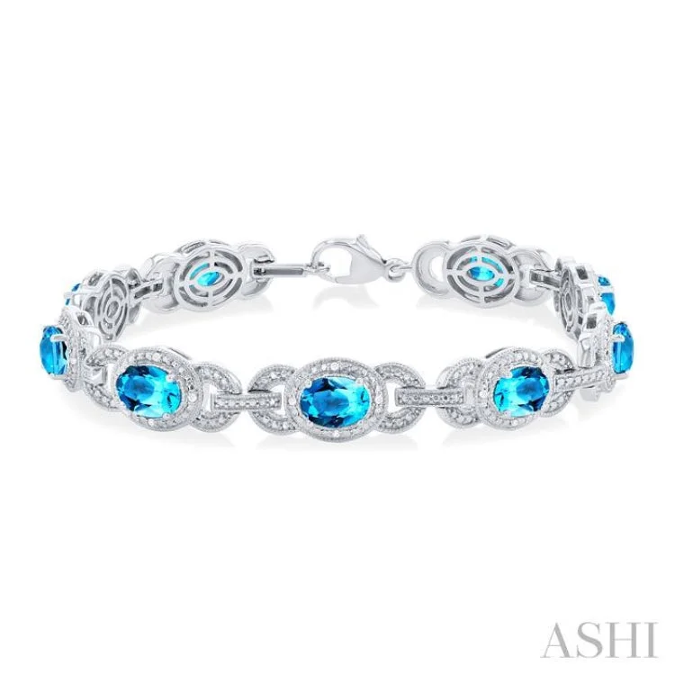 Ladies bracelets allergy-free-1/10 ctw Oval Cut 7x5MM Blue Topaz and Round Cut Diamond Semi Precious Bracelet in Sterling Silver